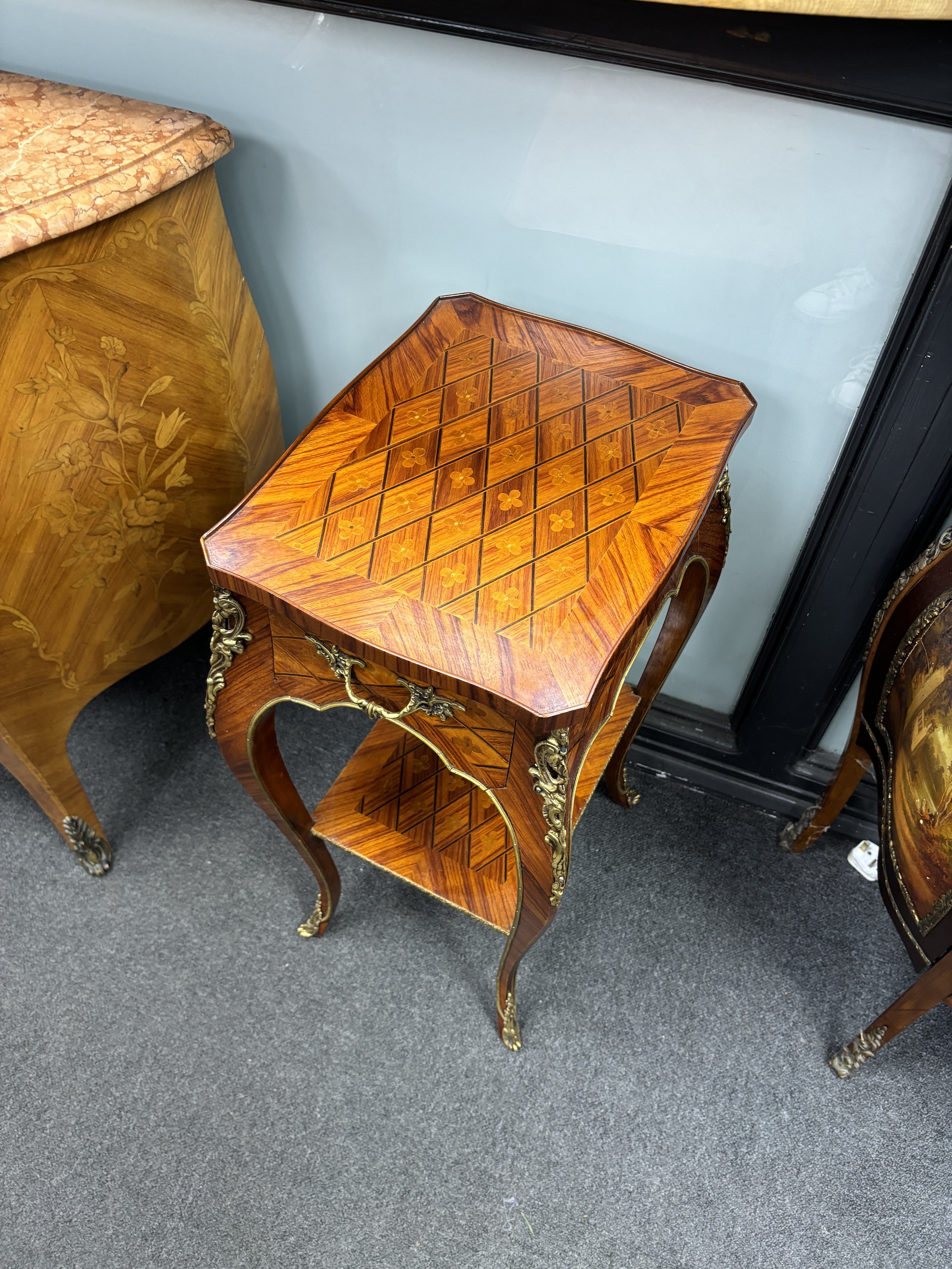A pair of French transitional style gilt metal mounted kingwood two tier tables, width 32cm, depth 42cm, height 76cm